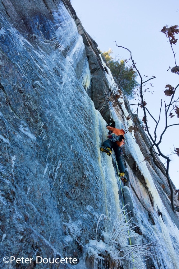 Bayard on a winter ascent of Lichen it a Lot. Cathedral Ledge. Photo by Peter Doucette.